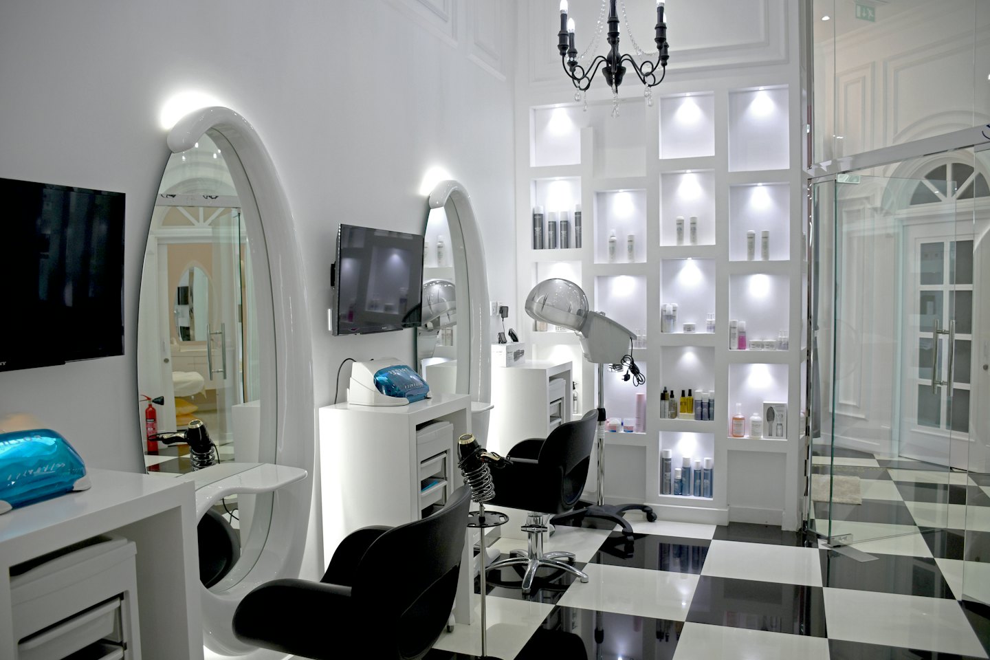Modern hair salon interior with black and white checkered floor.